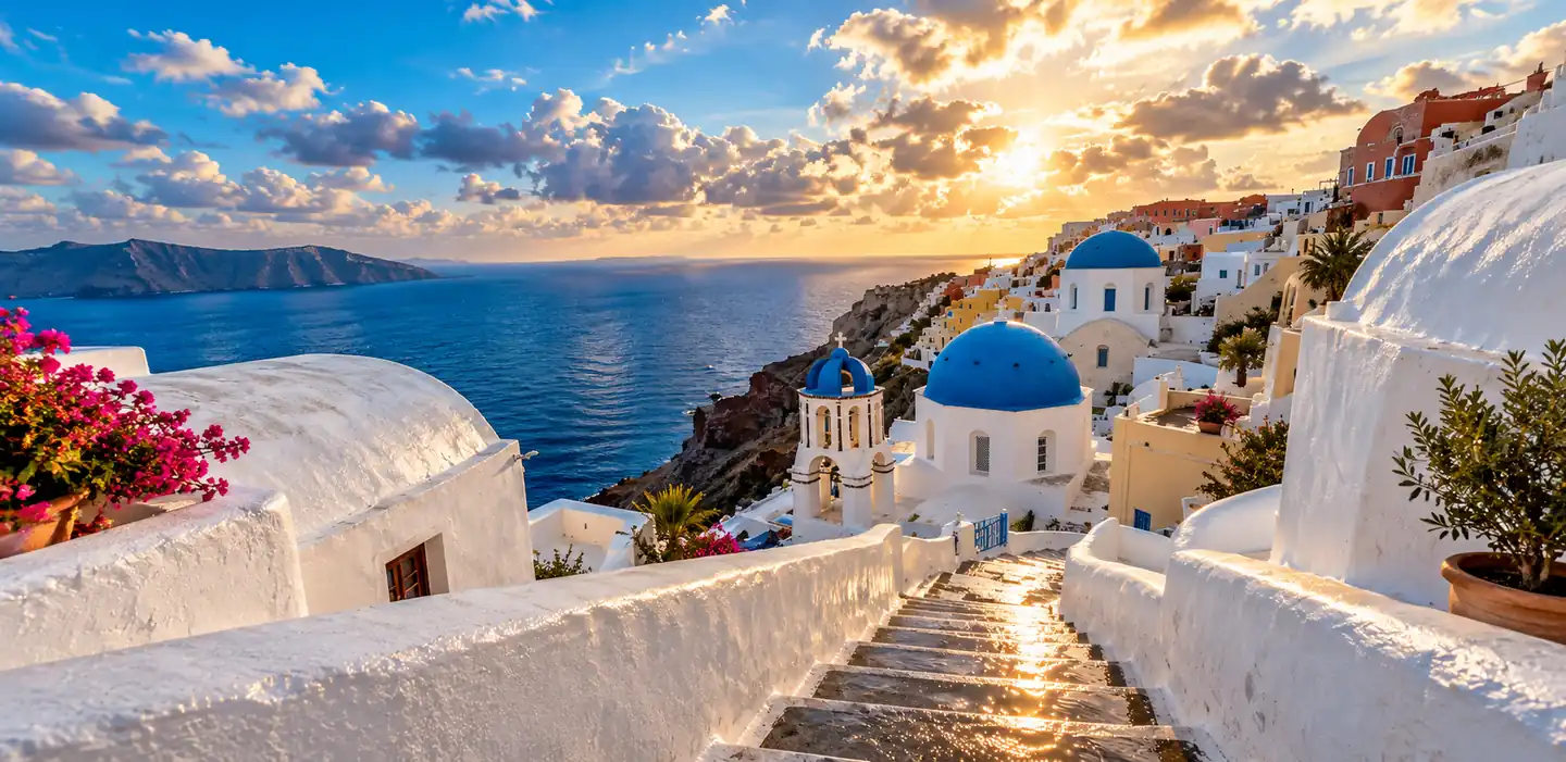 Blue-domed churches in Oia, Santorini, Greece at sunset